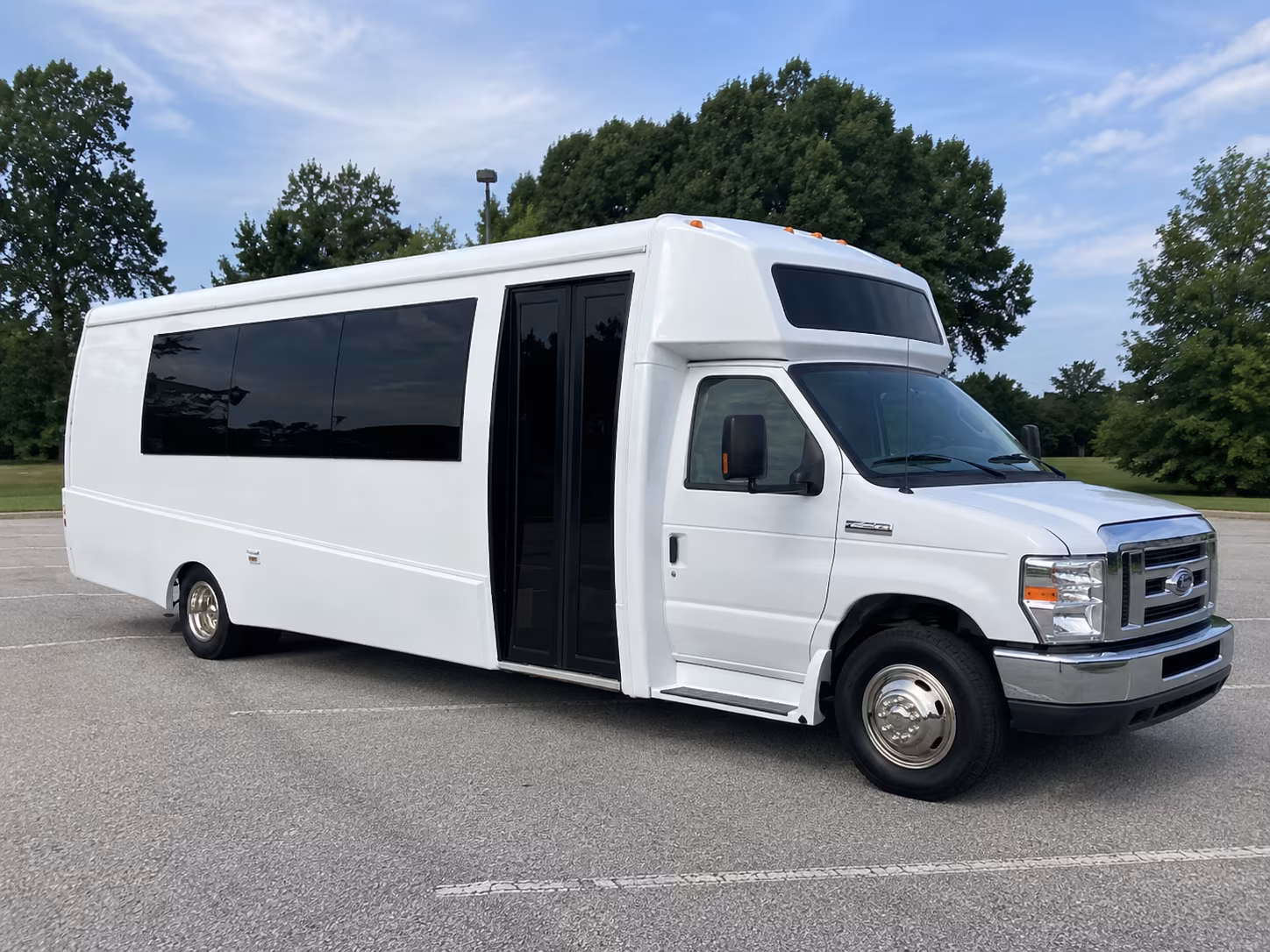Group beside a Mercedes Sprinter limo in Durham